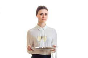 cute young waitress in uniform with trey photo