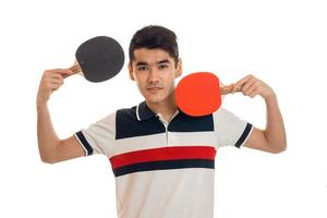 young brunette sports man playing ping-pong isolated on white background photo
