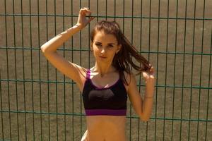 Portrait of a cute young girl in fitness black top photo