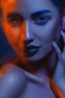 Creative portrait of cutie adult woman with mixed lights photo