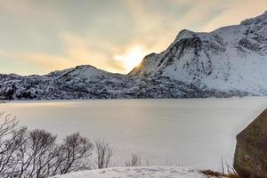 Snowy Lake Storvatnet in the Lofoten Islands, Norway in the winter. photo