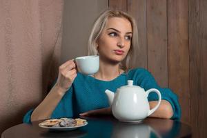 Girl drinking tea photo