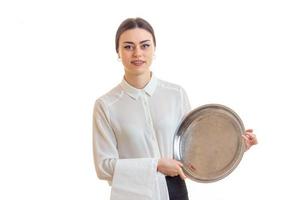 charming young waitress with trey in hands in uniform photo