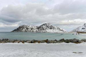 Skagsanden Beach in the Lofoten Islands, Norway in the winter on a cloudy day. photo