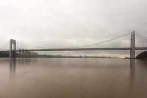 George Washington Bridge crossing the Hudson River on a overcast cloudy day from Fort Lee, New Jersey. photo
