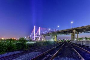 New and old Kosciuszko bridges joining Brooklyn and Queens in New York City across Newtown Creek. The new bridge is a cable-stayed bridge while the old bridge from 1939 is truss bridge. photo