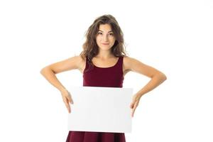 girl in red dress with white placard photo