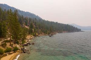 Secret Cove along Lake Tahoe in Nevada with a hazy sky due to nearby forest fires in California. photo