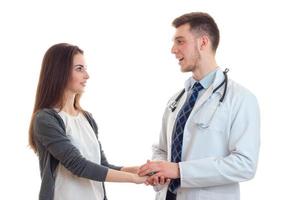 young smiling doctor lab coat holding hands sweet girl close-up photo