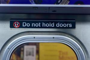 Brooklyn, New York - March 24, 2017 -  Do not hold doors indicator in the New York City subway system. photo