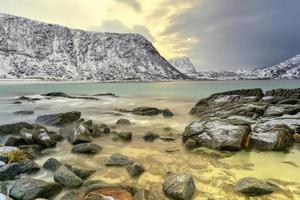 Haukland Beach in the Lofoten Islands, Norway in the winter at dusk. photo