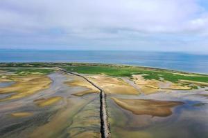 Provincetown Causeway also known as the Breakwater Walk, is an uneven collection of rocks that allows hikers to cross the harbor and reach the very tip of the Cape. photo