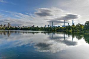 View across the New York City skyline from Central Park across the Jacqueline Kennedy Onassis Reservoir. photo