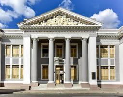 Cienfuegos, Cuba - Jan 13, 2017 -  The College of San Lorenzo, a neoclassical building across Marti Park in the Plaza de Armas in Cienfuegos, Cuba. photo