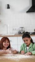 Young women play with flour on table video