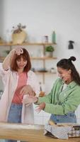 Young women play with flour on table video