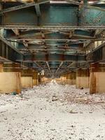 View of a New York City elevated subway underpass in the winter. photo