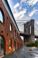 Brooklyn Bridge by Saint Anne's Warehouse in Brooklyn, New York after a rain shower. photo