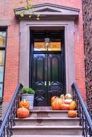 Classic Greek Revival Townhouse architecture in Greenwich Village in New York City during Halloween. photo