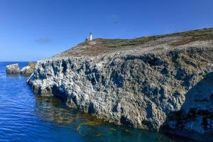 Anacapa island lighthouse with nesting seagulls at Channel Islands National Park in Ventura County California. photo