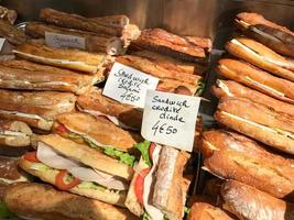 Fresh French Baguettes for sale in a window in Paris, France. photo