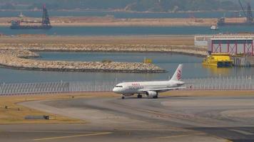HONG KONG NOVEMBER 10, 2019 - Airbus A320 DragonAir B HSG turn runway before departure from Chek Lap Kok International Airport, Hong Kong,. video