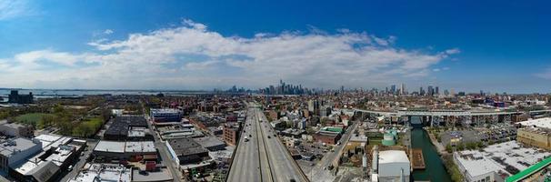 Panoramic view of the Gowanus Canal in Brooklyn with the Gowanus Expressway and Manhattan in the background. photo