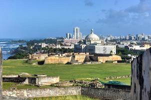 Puerto Rico Capitol and Castillo de San Cristobal, San Juan, Puerto Rico. Castillo de San Cristobal is designated as UNESCO World Heritage Site since 1983. photo