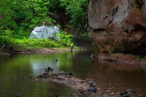 A Small Rocky Forest River in Summer photo