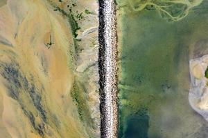 Provincetown Causeway also known as the Breakwater Walk, is an uneven collection of rocks that allows hikers to cross the harbor and reach the very tip of the Cape. photo