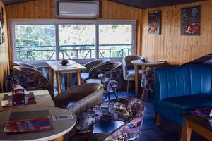 Kasauli, Himachal Pradesh, India, May 15,2022 - Inside view of modern rooftop restaurant Hangout at Kasauli, Himachal Pradesh in India, Hangout famously know as open air Rooftop restaurant in Kasauli photo