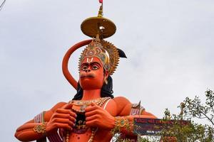 Big statue of Lord Hanuman near the delhi metro bridge situated near Karol Bagh, Delhi, India, Lord Hanuman big statue touching sky photo