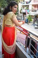 Beautiful woman dressed up as Indian tradition with henna mehndi design on her both hands to celebrate big festival of Karwa Chauth, Karwa Chauth celebrations by Indian woman for her husband photo