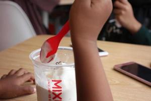 Magelang,Indonesia,2022-ice cream which is popular among young people with clear plastic packaging. photo