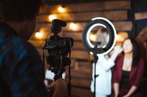 Videographer shoots a video report photo