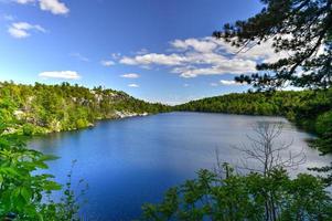 Massive rocks and view to the valley at Minnewaska State Park Reserve Upstate NY during summer time. photo