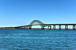 The Fire Island Inlet Bridge, an integral part of the Robert Moses Causeway, is a two-lane, steel arch span with a concrete deck that carries the parkway over Fire Island Inlet. photo