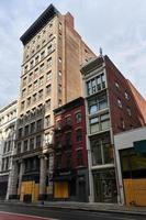 New York City, New York - June 11, 2020 -  Store closed during the COVID-19 pandemic, with boarded up windows to protect against looting as a result of anti-police brutality protests. photo