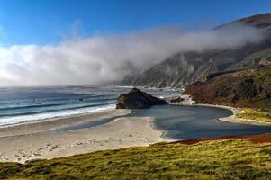 Ocean fog rolling in onto Highway 1 and Big Sur, California, USA photo