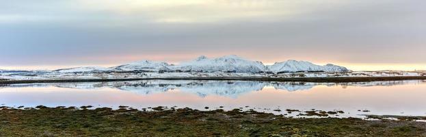 Sunrise on Hestnesbukta on the island of Vestvagoy in the Lofoten Islands, Norway in the winter. photo