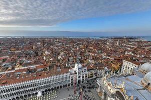 Aerial view of Saint Mark's Square in Venice Italy. It is the principal public square of Venice, Italy, where it is generally known just as la Piazza. photo