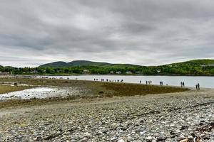 Dirt path to Bar Island at low-tide at Bar Harbor in Acadia National Park, Maine photo