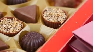 peanut chocolate candy in a container on table video