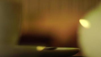 white mug with tea on a table in the Cafe video