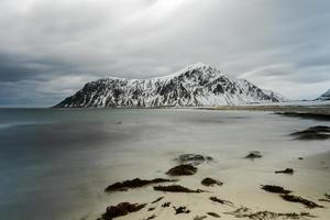 Skagsanden Beach in the Lofoten Islands, Norway in the winter on a cloudy day. photo