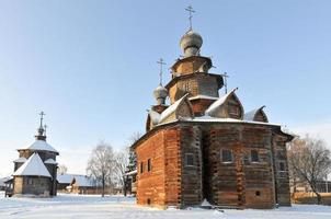 The Wooden Church of the Resurrection of Christ in the Museum of Wooden Architecture and Peasants' Life on a Winter Day in Suzdal, Russia. photo