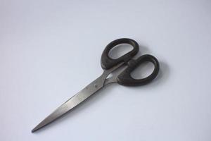 used scissors on a plain white background. photo