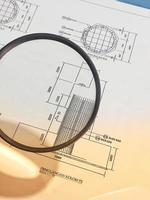 A magnifying glass is often used to view and magnify detailed shop drawings photo