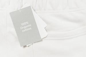 Paper label on a white 100 percent organic cotton clothing photo