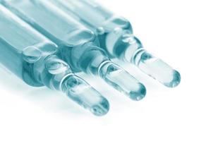 Ampoules with vaccine, medical remedy or cosmetics photo